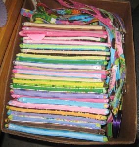 box of zip pouches and laynards